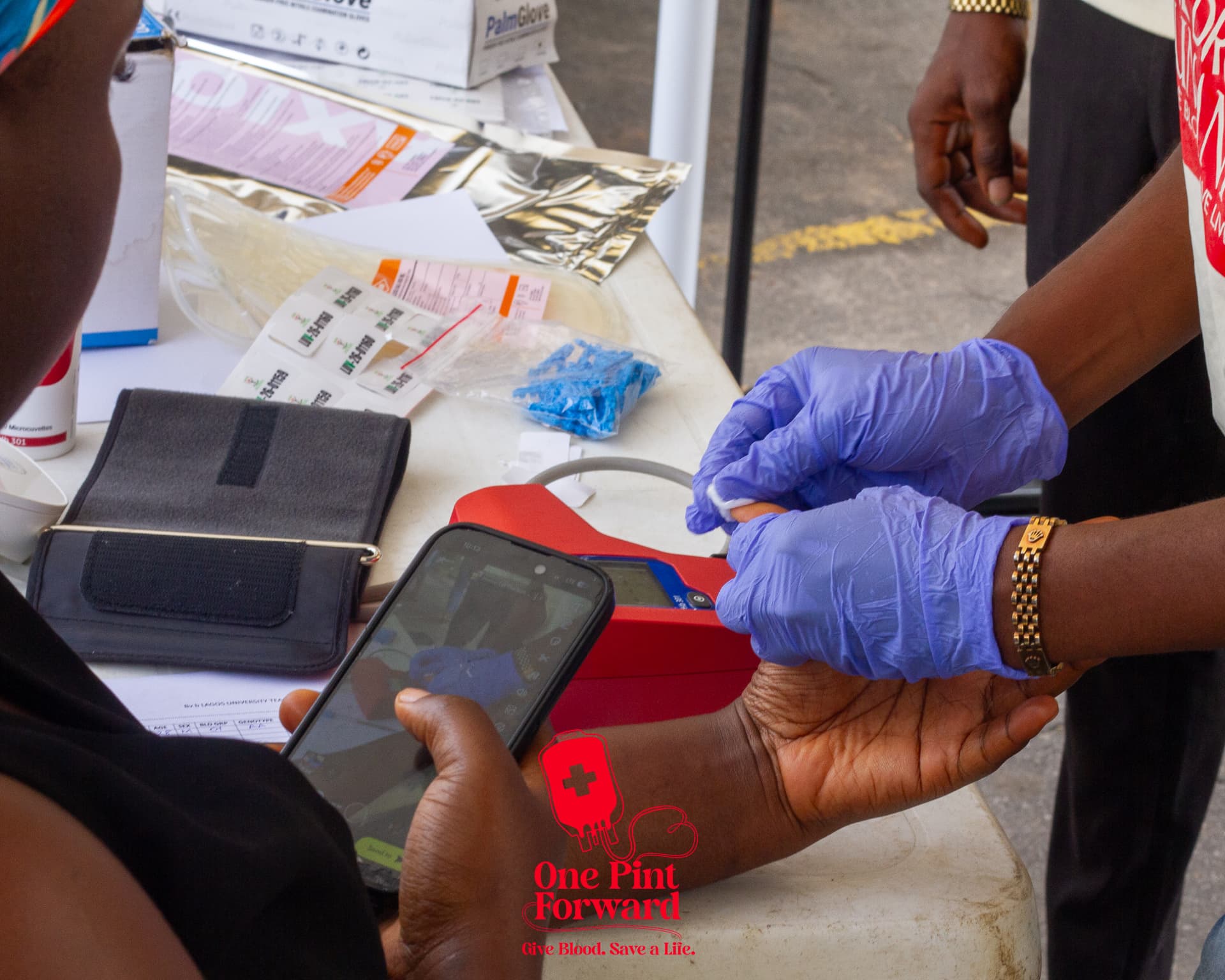 Volunteers and medical staff carrying out donor screening at the drive